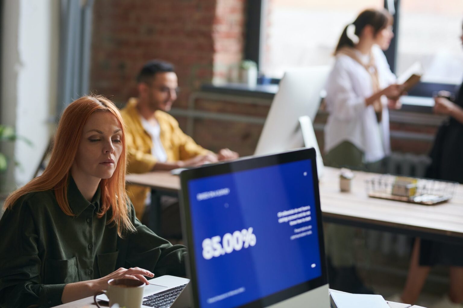 woman seated working on computer